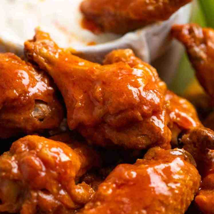 Close up of Buffalo Wings - crispy oven baked wings tossed in Buffalo Sauce