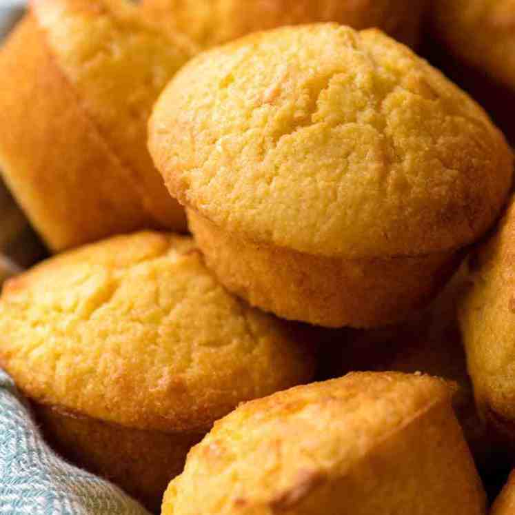 Close up of Cornbread Muffins in a basket, fresh out of the oven