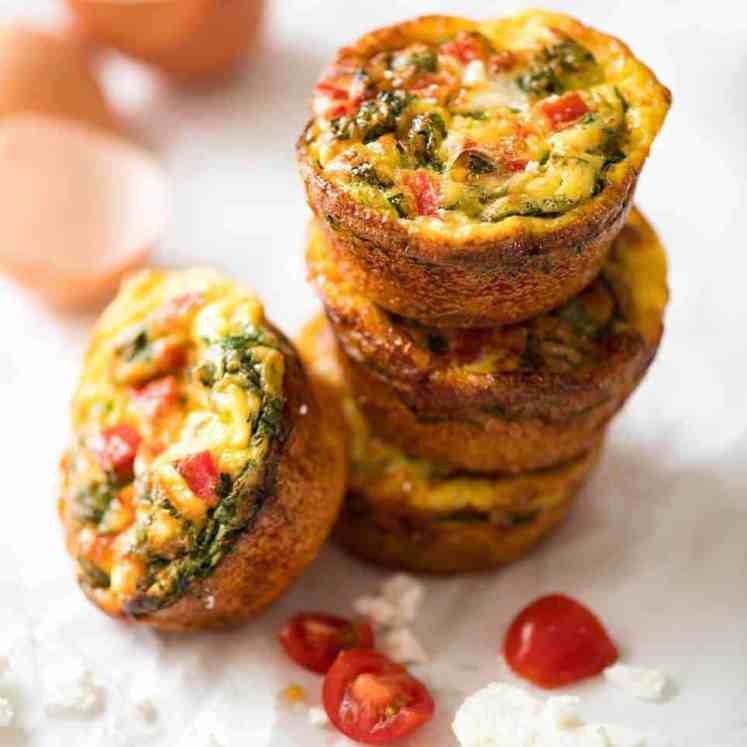 Healthy doesn't have to be bland! These Healthy Egg Muffins are a great grab & go breakfast option. Egg, spinach, feta, cherry tomatoes and bell peppers/capsicum. recipetineats.com