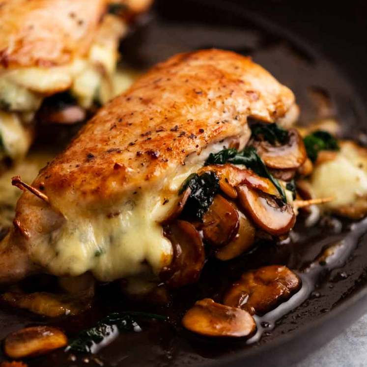 Mushroom Stuffed Chicken Breast in a skillet, fresh out of the oven
