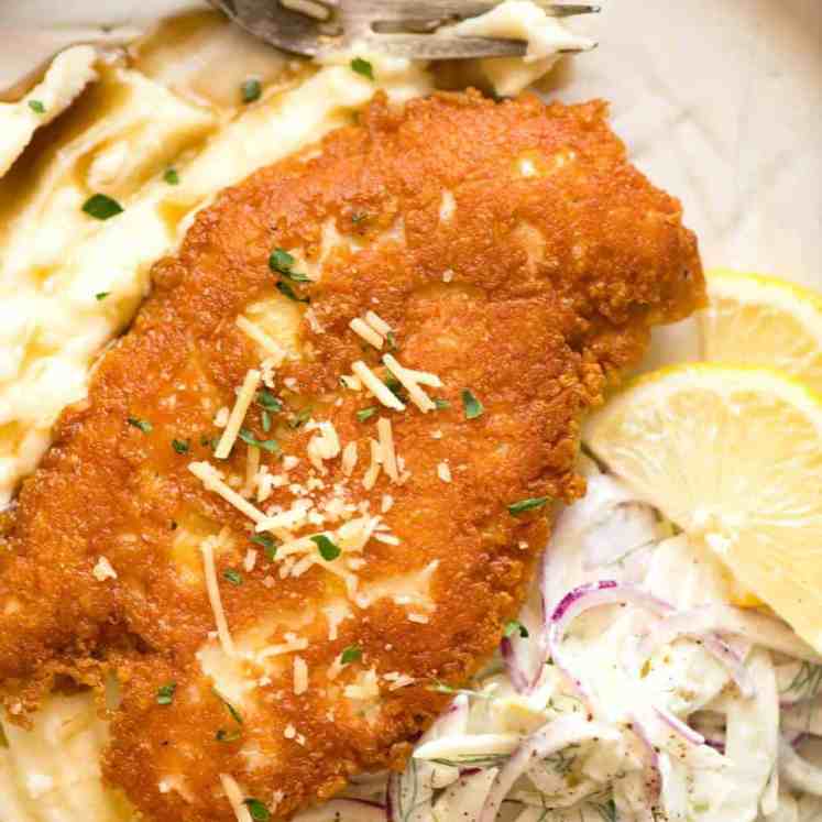 Parmesan Crusted Chicken Breast - golden brown and crispy on the outside, juicy on the inside.