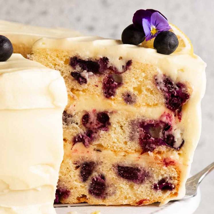 Slice of Blueberry Cake with Lemon Cream Cheese Frosting on a plate